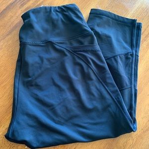 Black cropped leggings with mesh cutouts